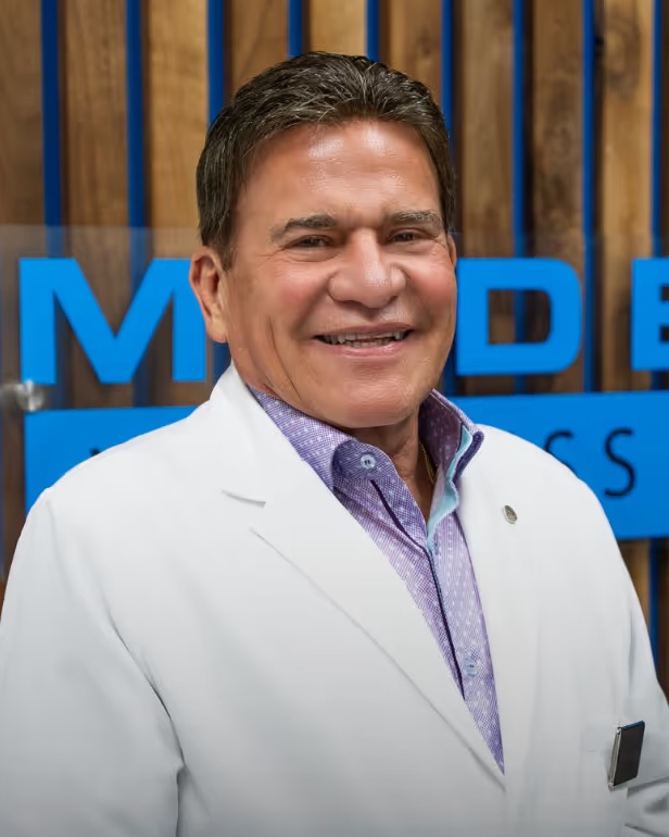 Robert J. Webb, PA, in a white coat.